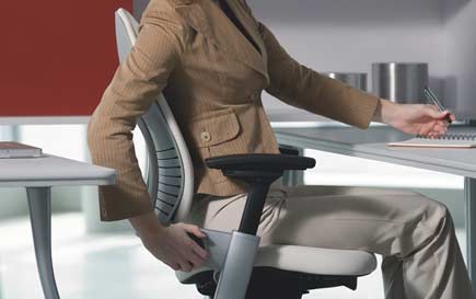 Woman-Adjusting-Chair._V393907590_